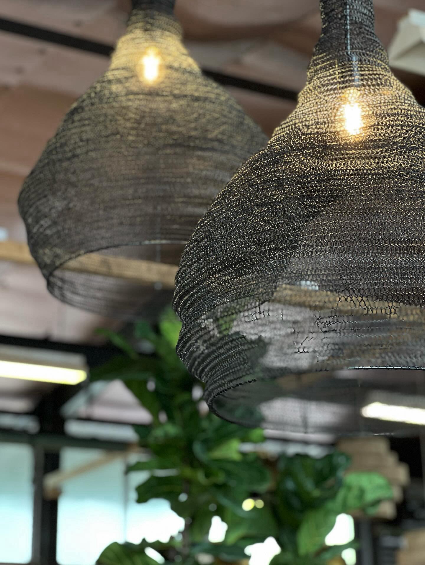 Handcrafted pendant light with a brushed wire design