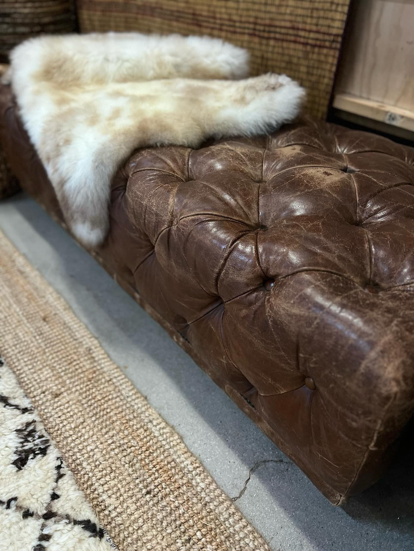 Classic Chesterfield ottoman upholstered in genuine leather